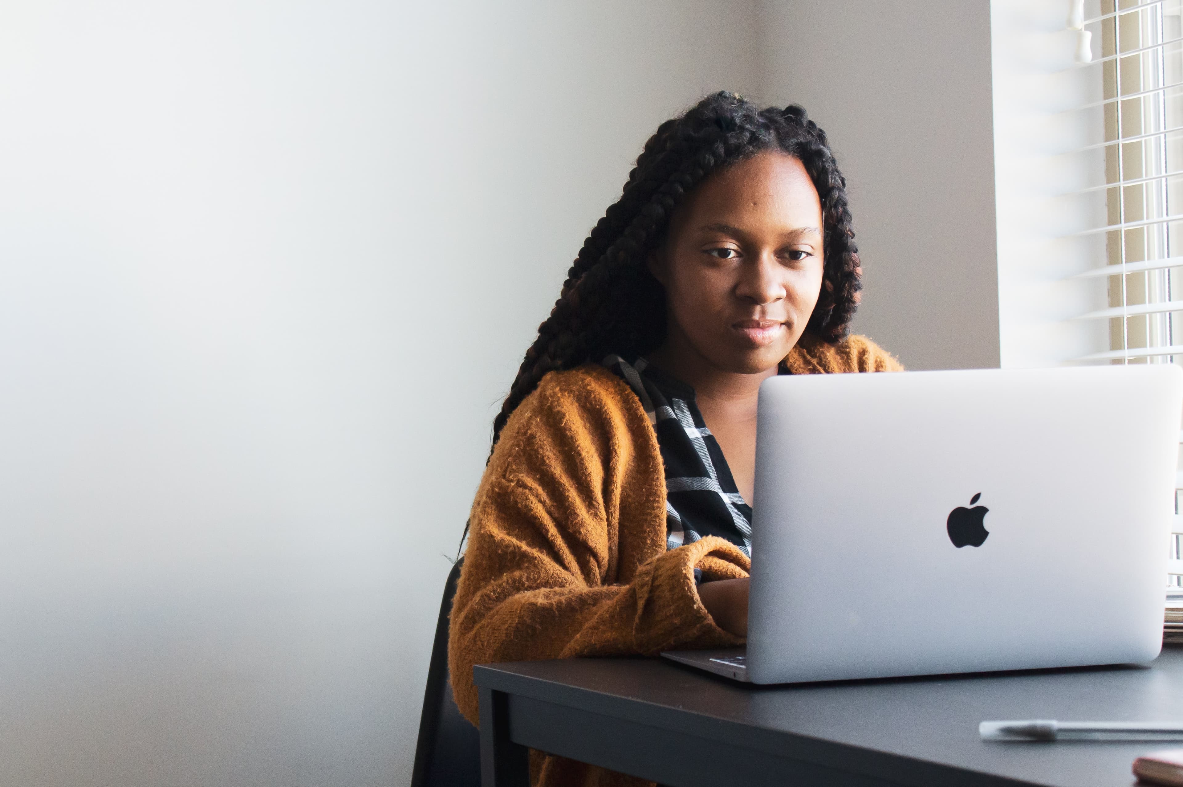 female with mac book pro.